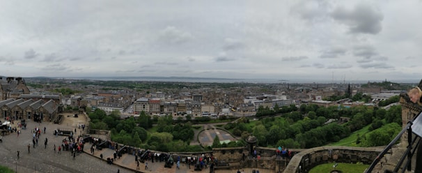 A scenic view of Edinburgh with travelers exploring the city.