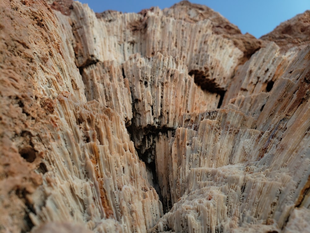 brown rock formation under blue sky during daytime