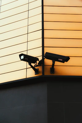 A high-definition CCTV camera installed on a home's exterior corner, capturing clear surveillance footage.