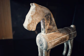 brown wooden horse shoe on black table