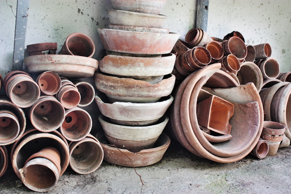 brown clay pots on gray concrete floor