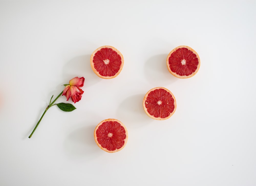 orange fruits on white surface