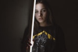 woman in black and yellow crew neck shirt