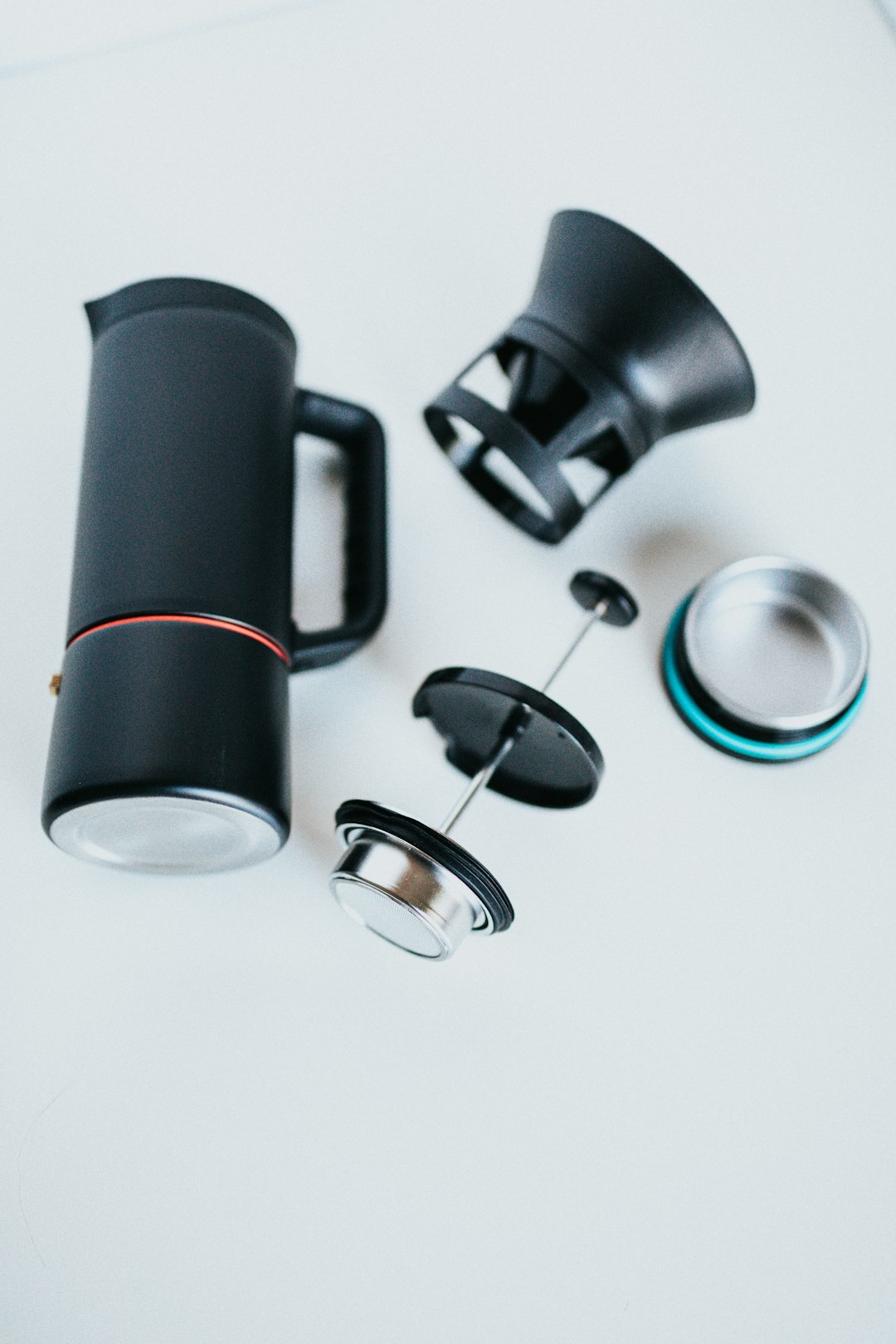 black and silver headphones on white table