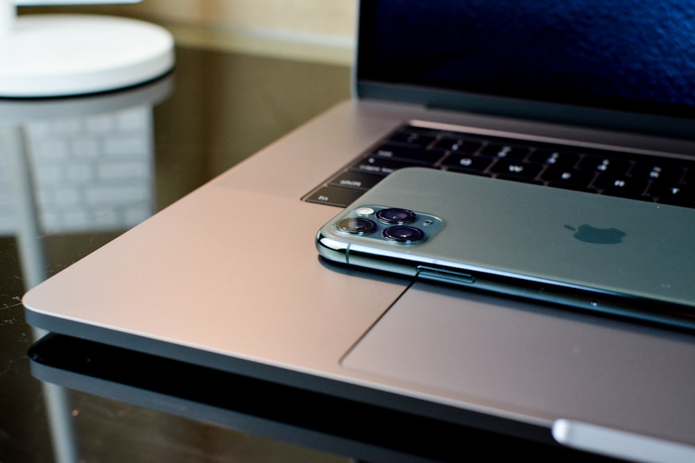 a laptop computer sitting on top of a table