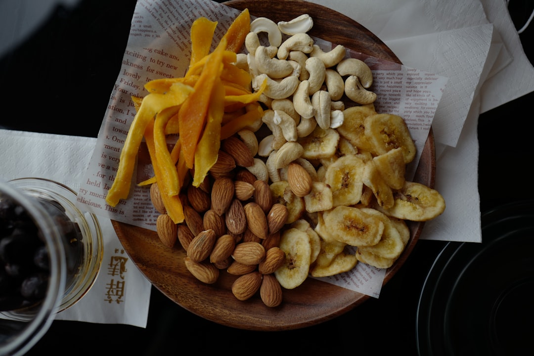 brown and white mushrooms on brown wooden round plate