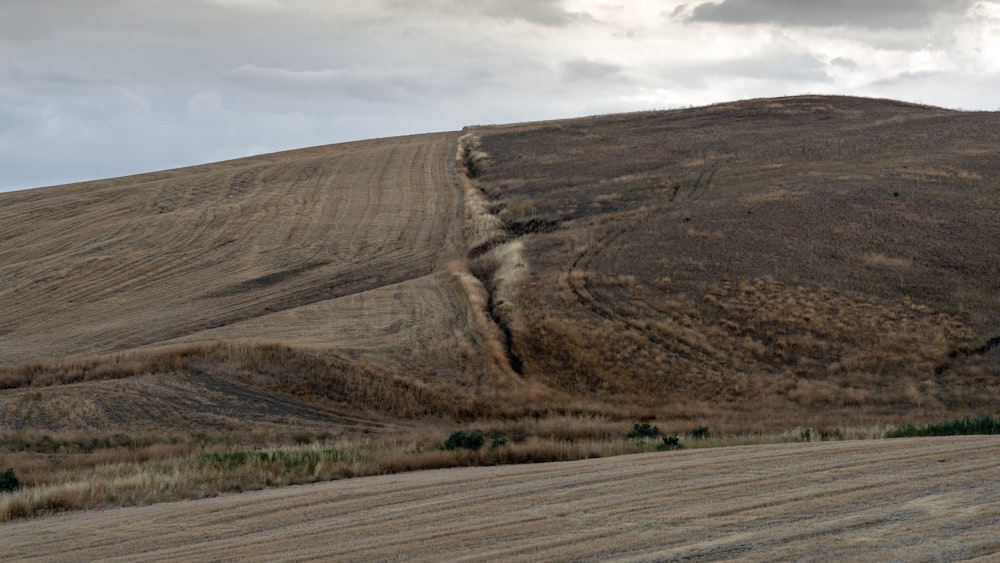 brown mountain under white sky during daytime