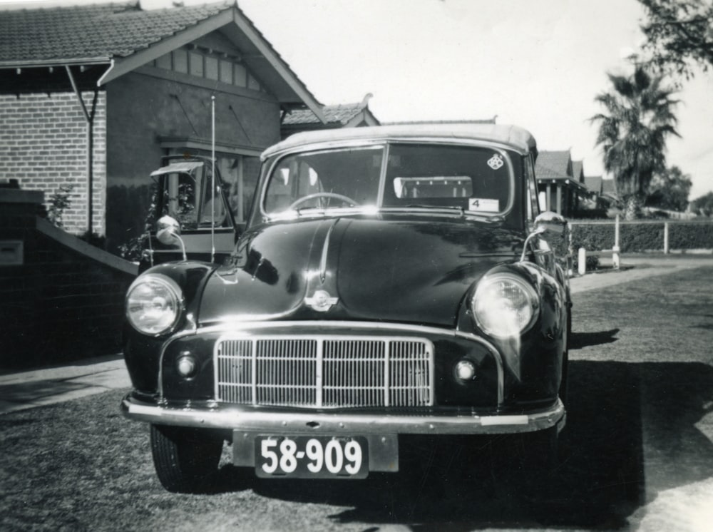 grayscale photo of vintage car