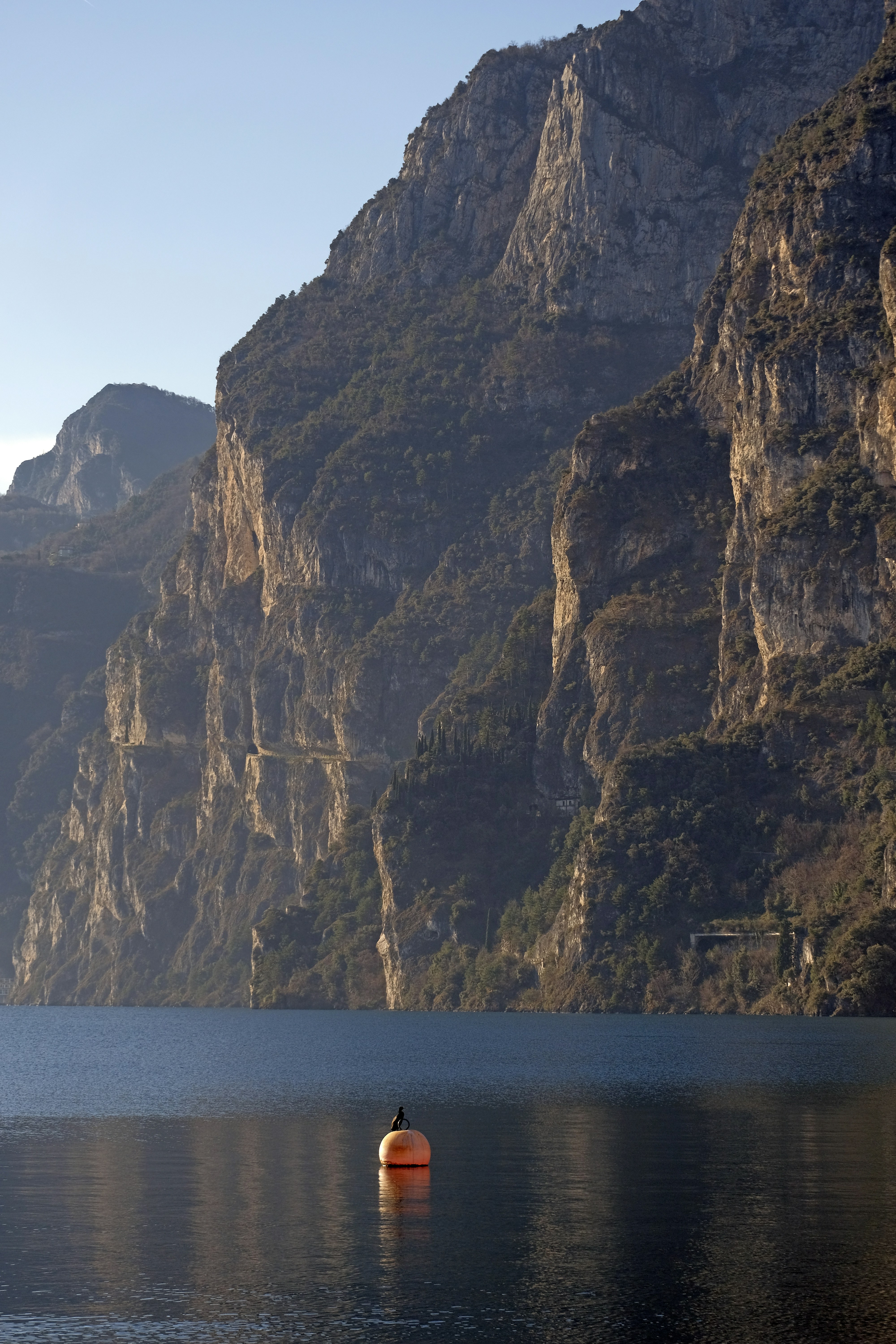 apricot-toned rocks being washed by Garda lake