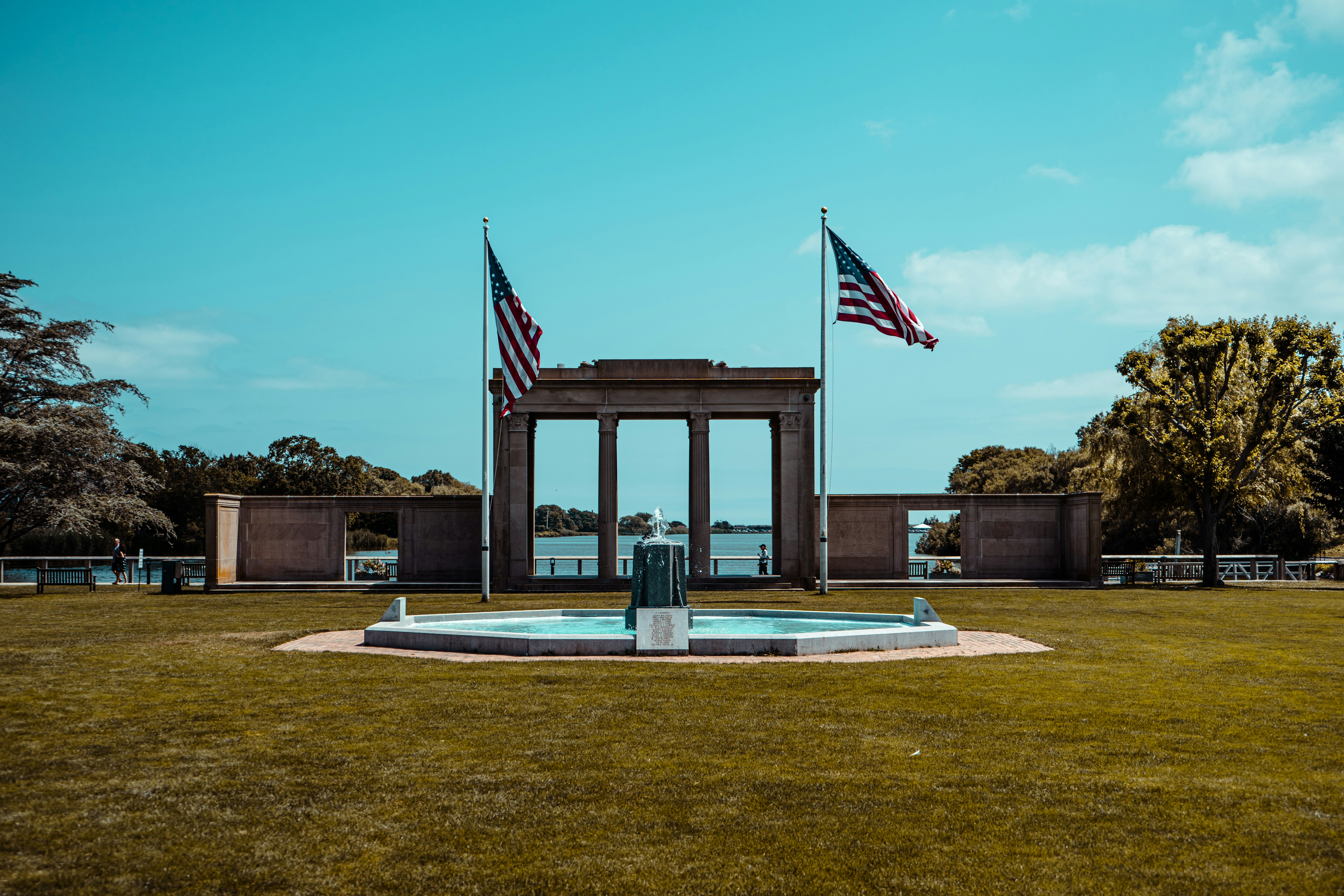 us a flag on brown wooden post