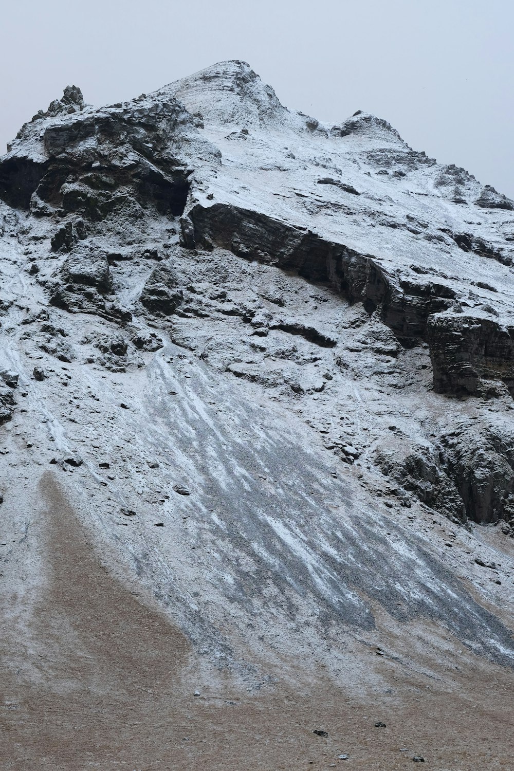 gray rocky mountain under white sky during daytime