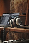 black laptop computer on brown wooden table