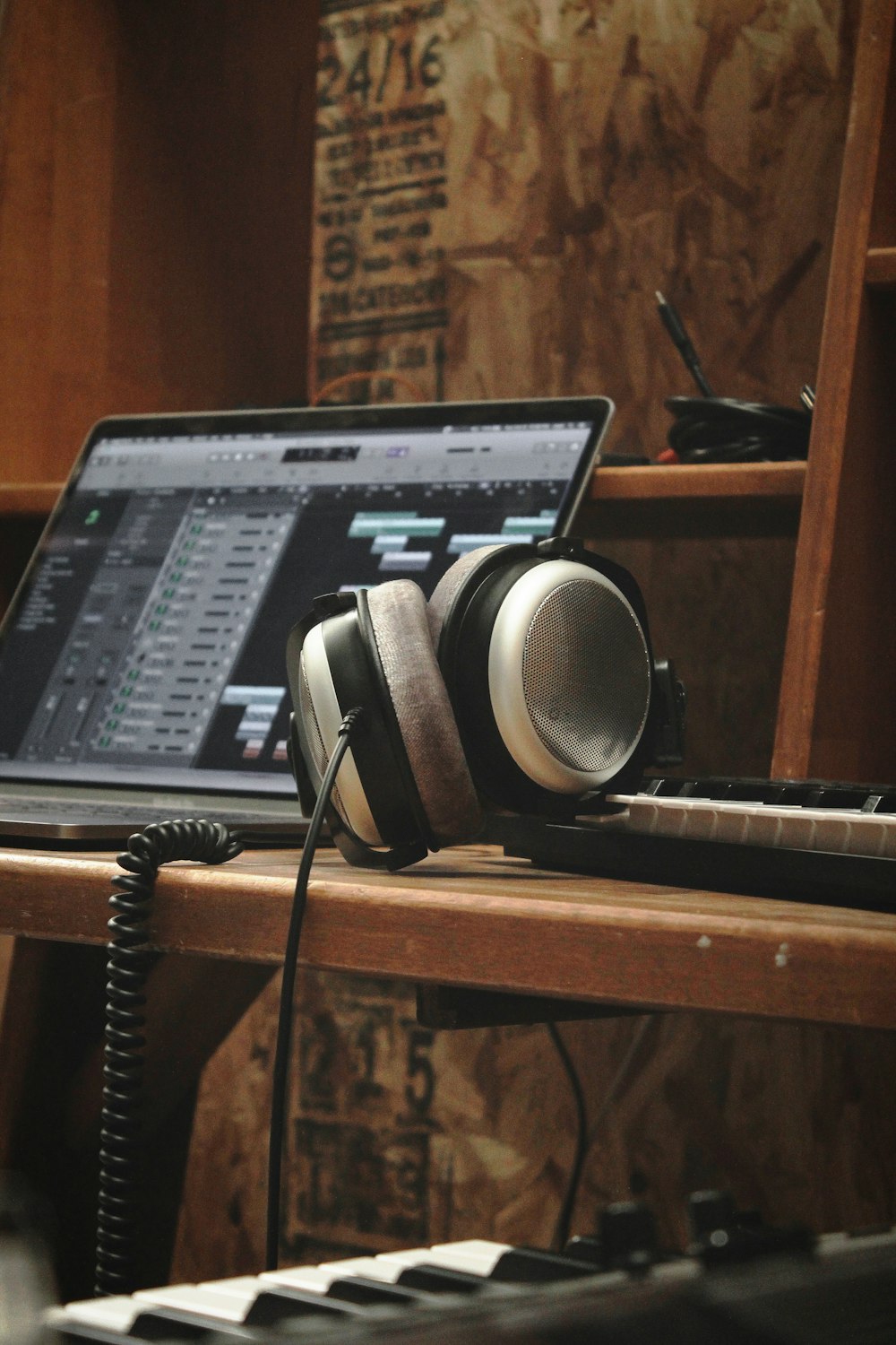 black laptop computer on brown wooden table