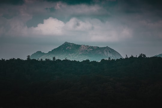 green mountain under white clouds in Karnataka India