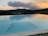A beautifully crafted fiberglass pool at sunset with a peaceful Tennessee landscape.