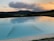 A beautifully crafted fiberglass pool at sunset with a peaceful Tennessee landscape.