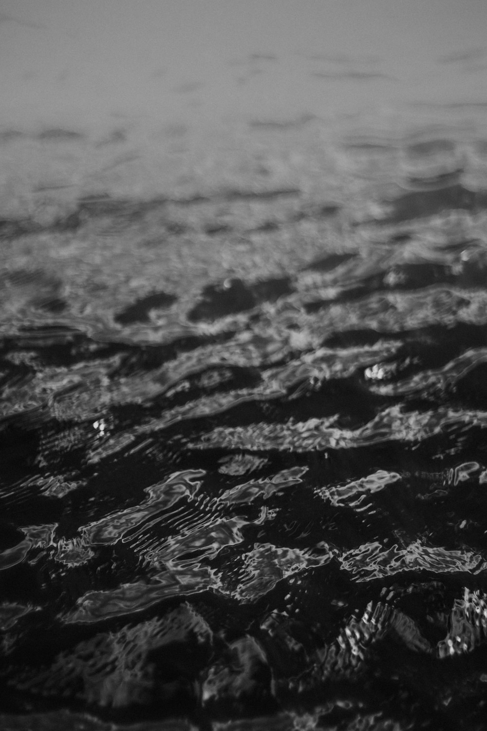 grayscale photo of water splash