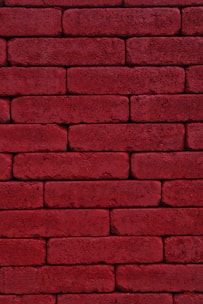 red brick wall during daytime