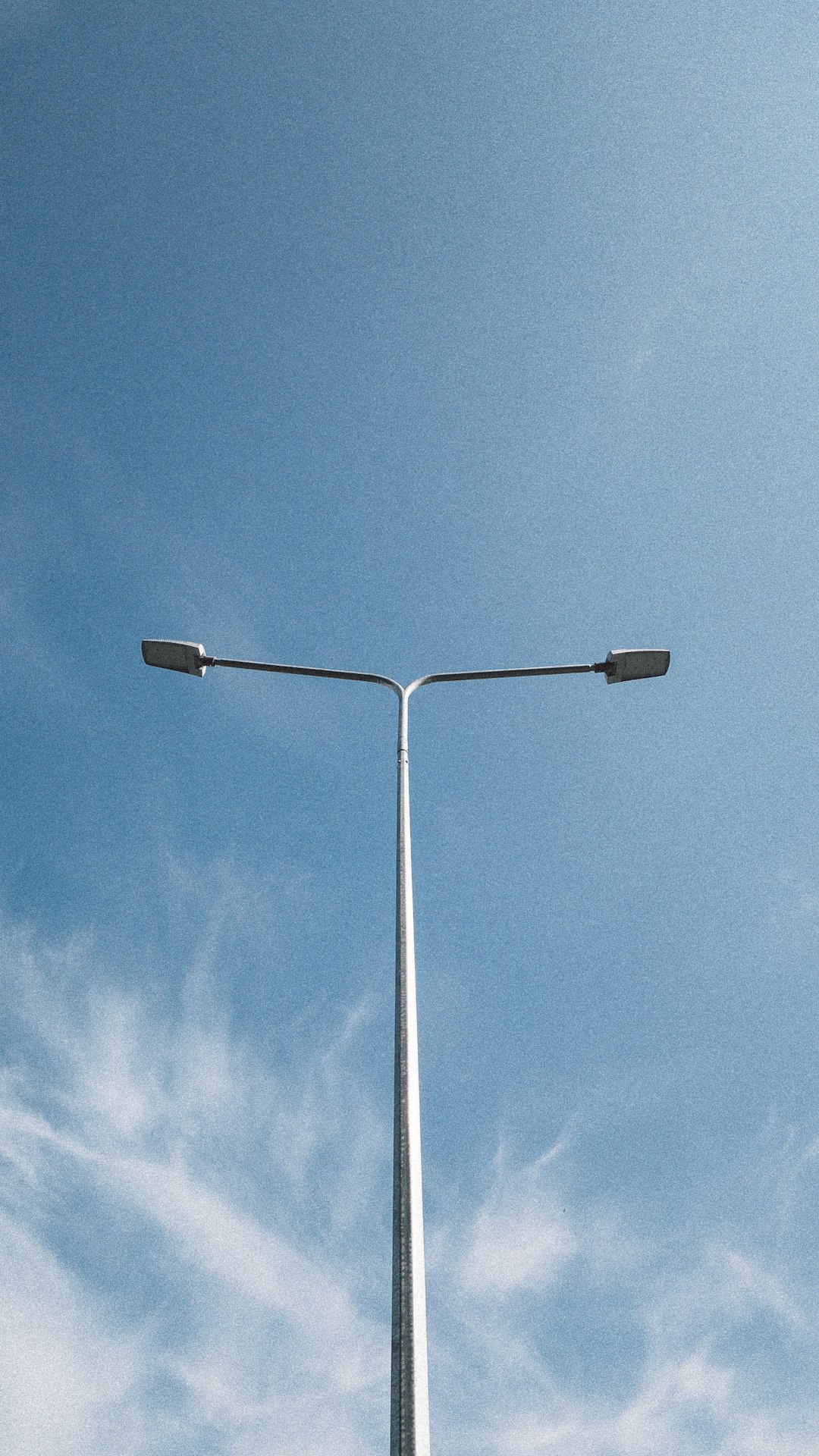 white street light under blue sky during daytime