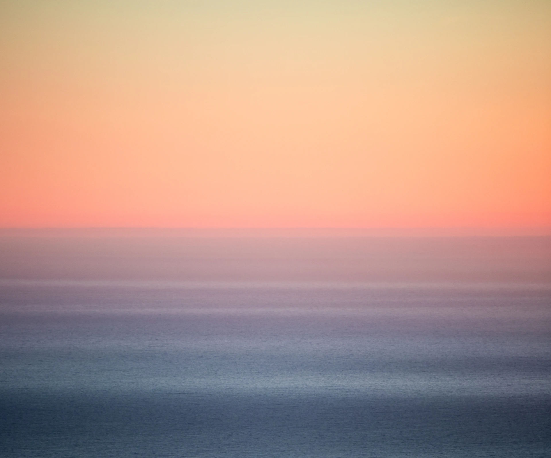 blue body of water under blue sky during daytime