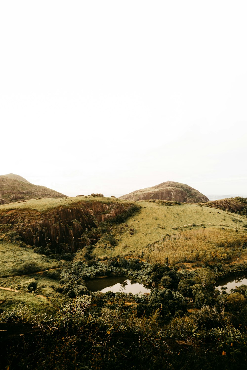 brown mountain under white sky during daytime