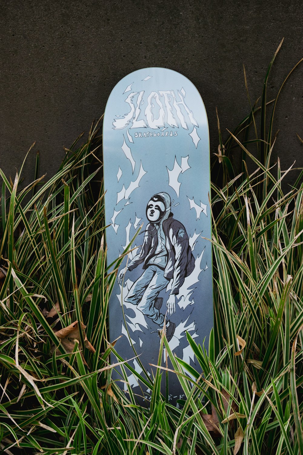 white and blue floral skateboard
