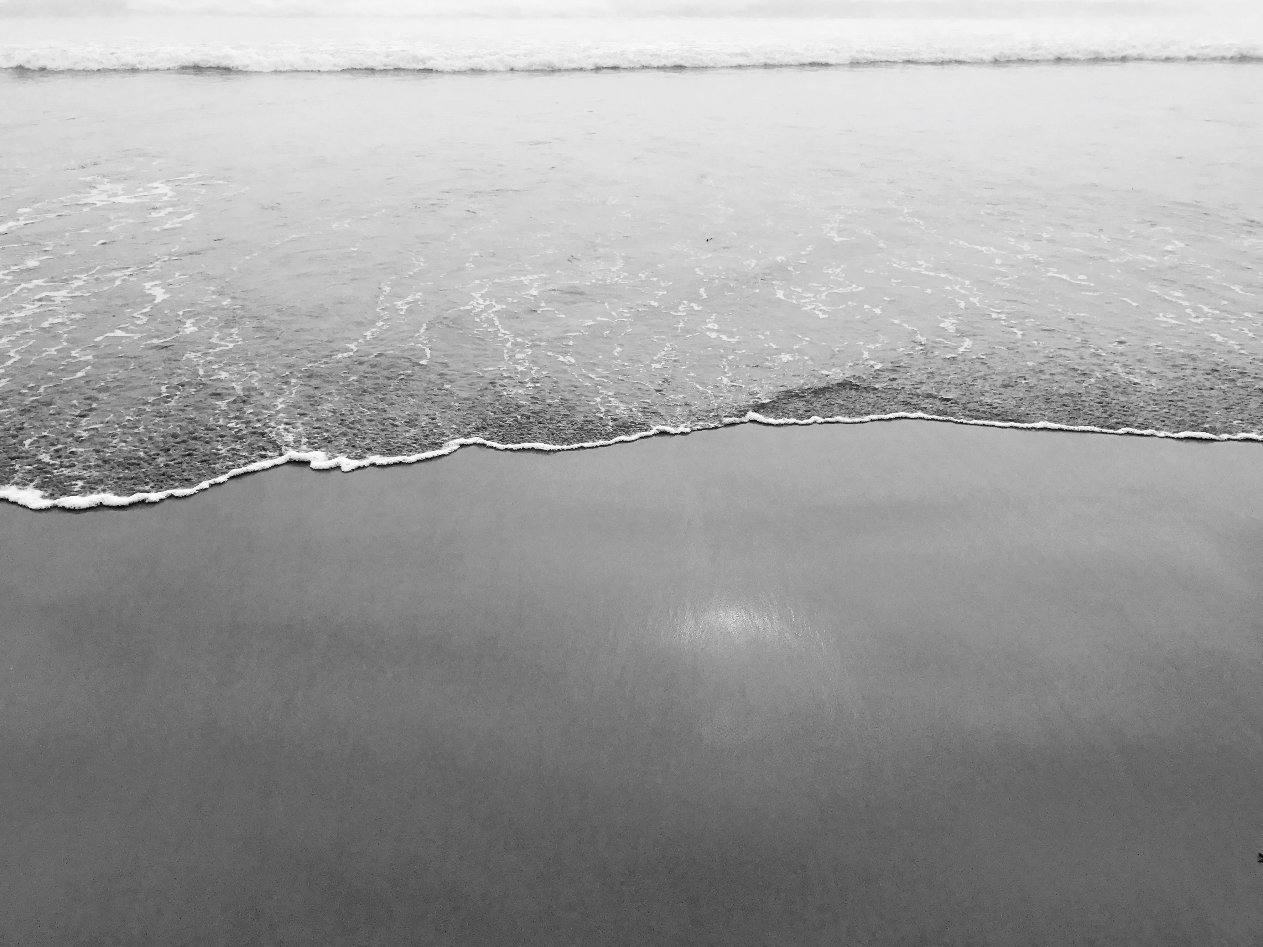 grayscale photo of water waves