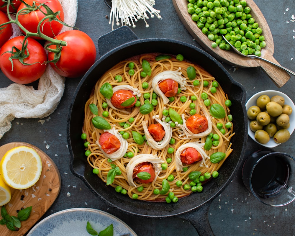 red tomato on black round plate