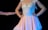 A person wearing a delicate ballet dress featuring a fitted bodice with decorative embellishments and a flowing skirt. The dress has a soft pink hue and is adorned with subtle sparkles. The background is dark, emphasizing the bright colors of the attire and the performer’s pose.