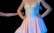 A person wearing a delicate ballet dress featuring a fitted bodice with decorative embellishments and a flowing skirt. The dress has a soft pink hue and is adorned with subtle sparkles. The background is dark, emphasizing the bright colors of the attire and the performer’s pose.