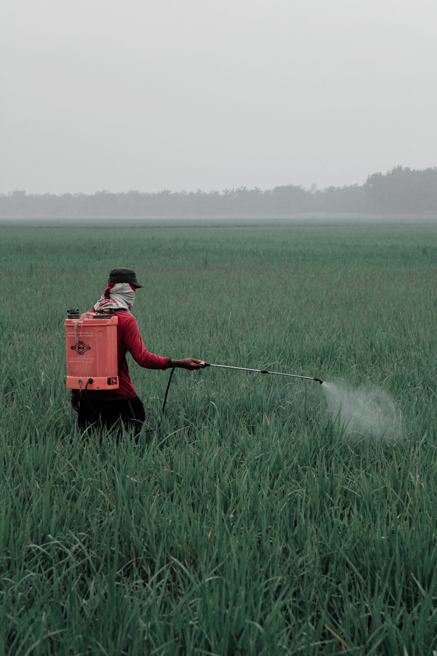 Pest control technician with spray equipment treating a property in Calgary