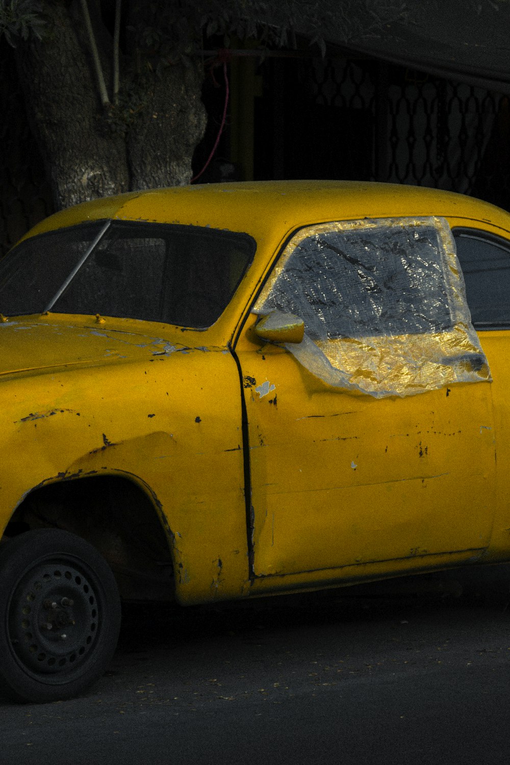 yellow car with white snow on top