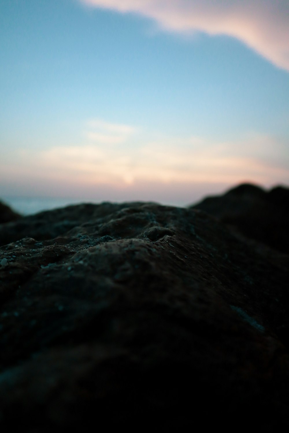 black rock formation during sunset