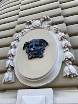 Detail of the intricate craftsmanship on the eyewear's temple inspired by Medusa’s serpentine hair.