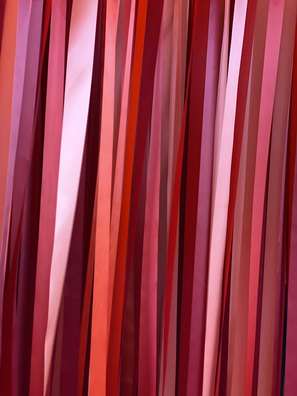 pink and white striped textile