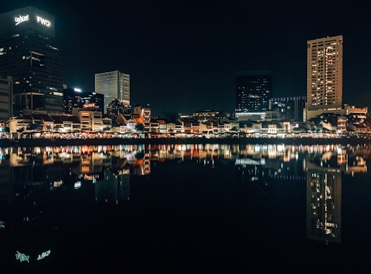 city skyline during night time in Boat Quay Singapore