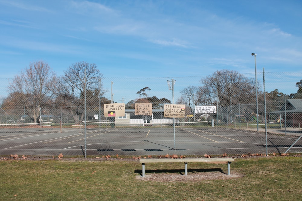 brown bare trees near white concrete building during daytime