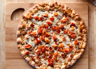 pizza on brown wooden table