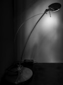 A modern lamp illuminating a sophisticated study area.