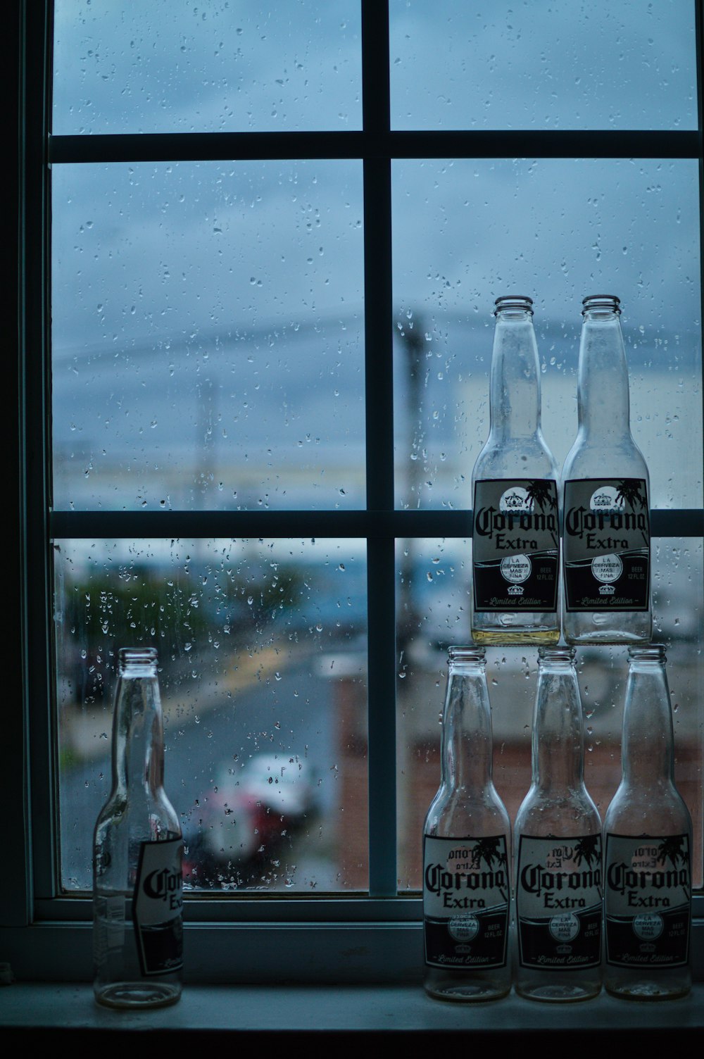 coca cola zero bottles on window