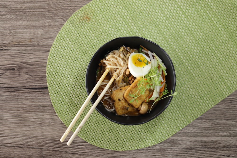 pasta dish on black ceramic bowl