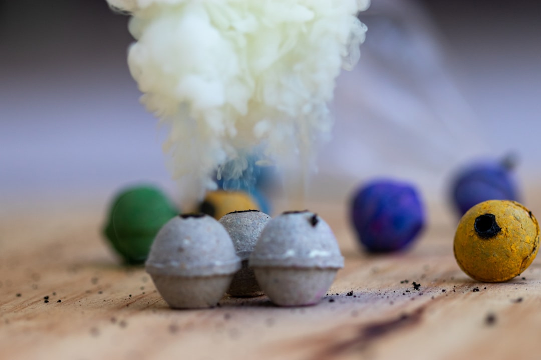 white cotton ball on brown wooden table