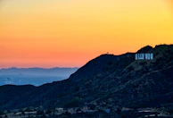 A panoramic view of the Los Angeles skyline at sunset, symbolizing our local roots.