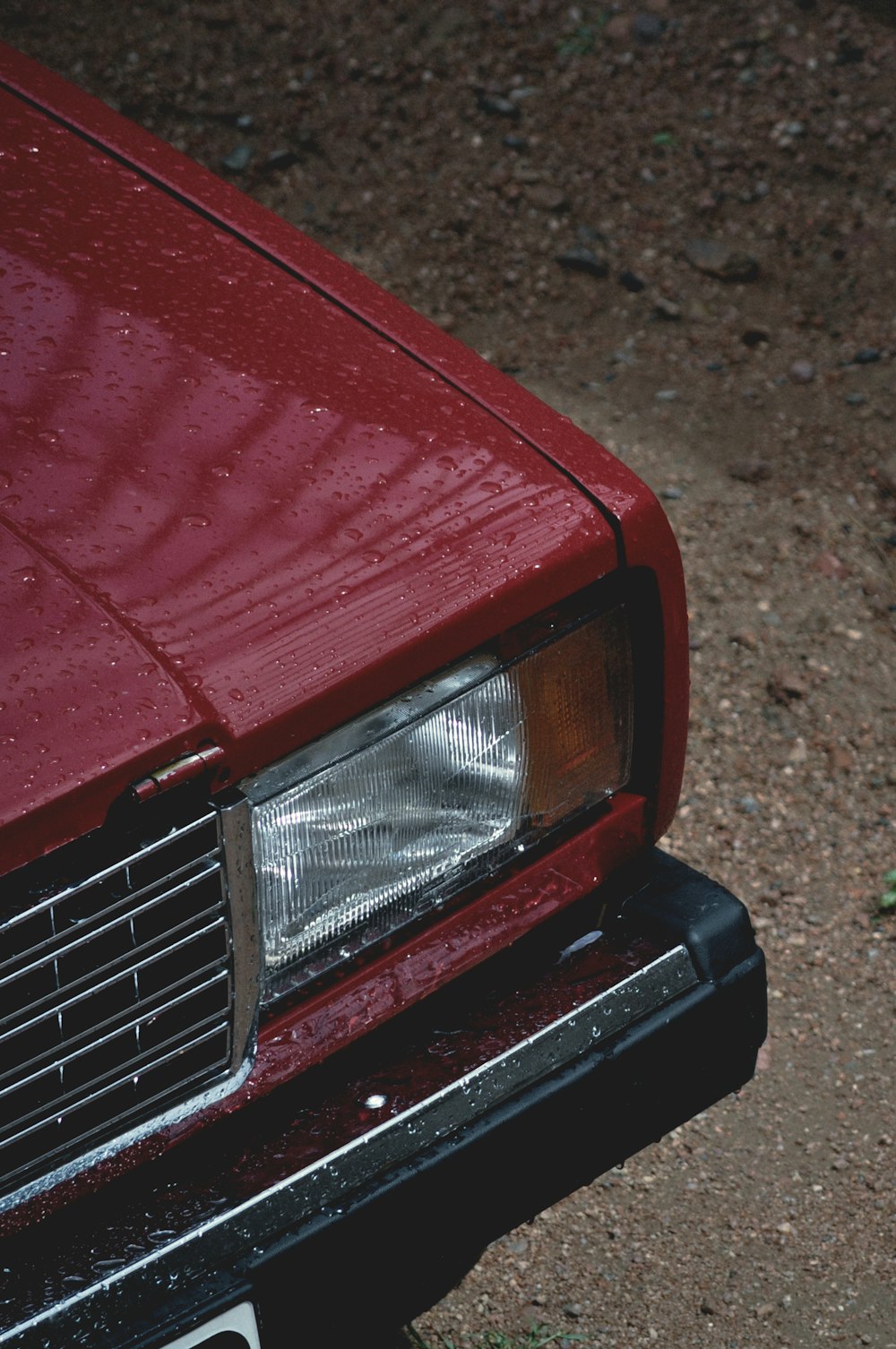 red car on brown soil