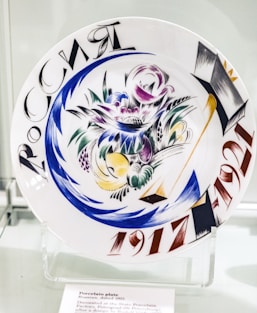 white blue and red floral ceramic plate