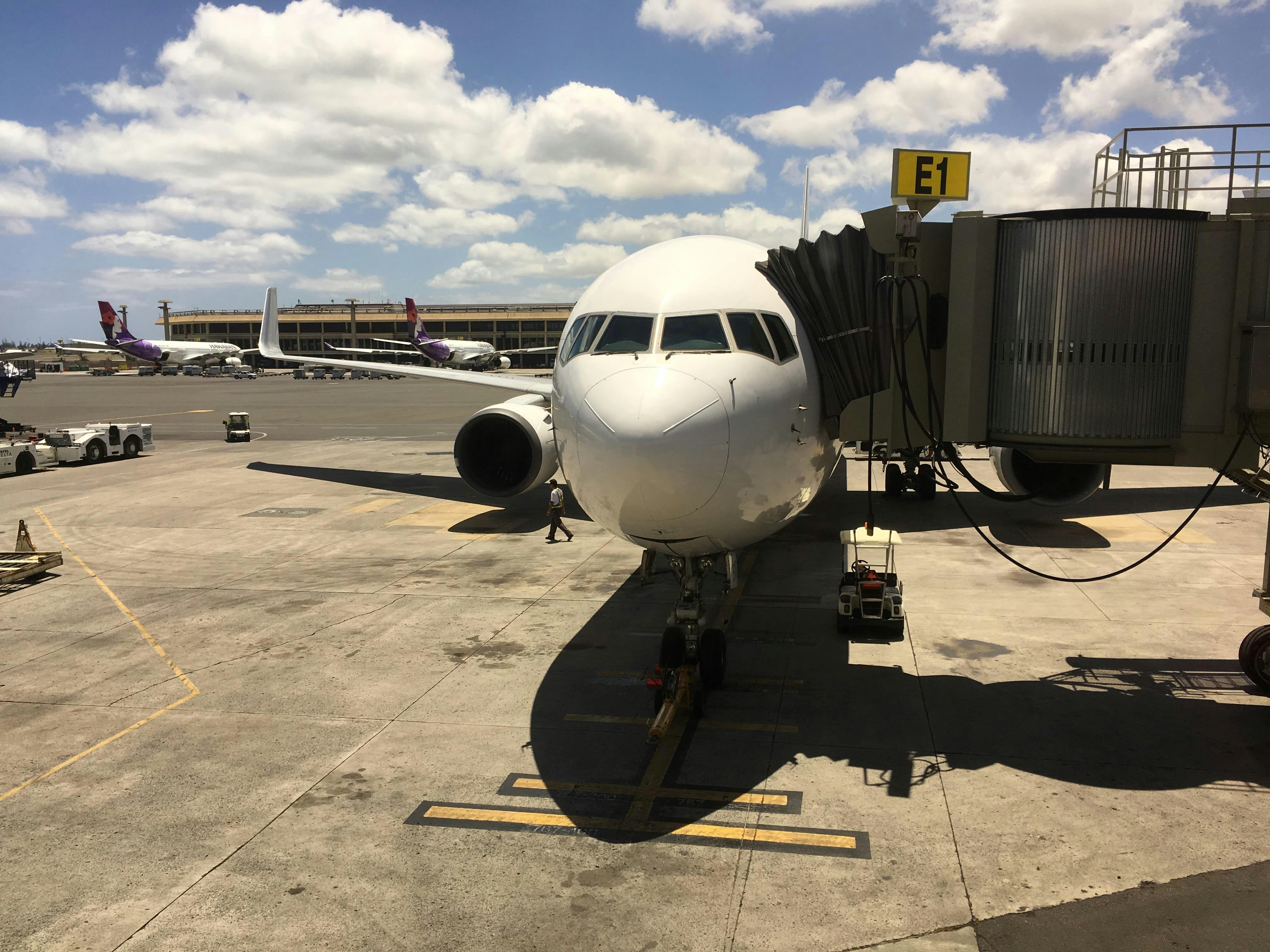 white airplane on airport during daytime