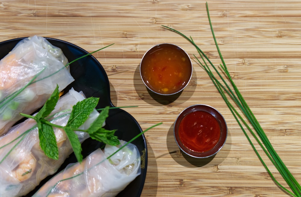 2 red sauce on black ceramic bowl