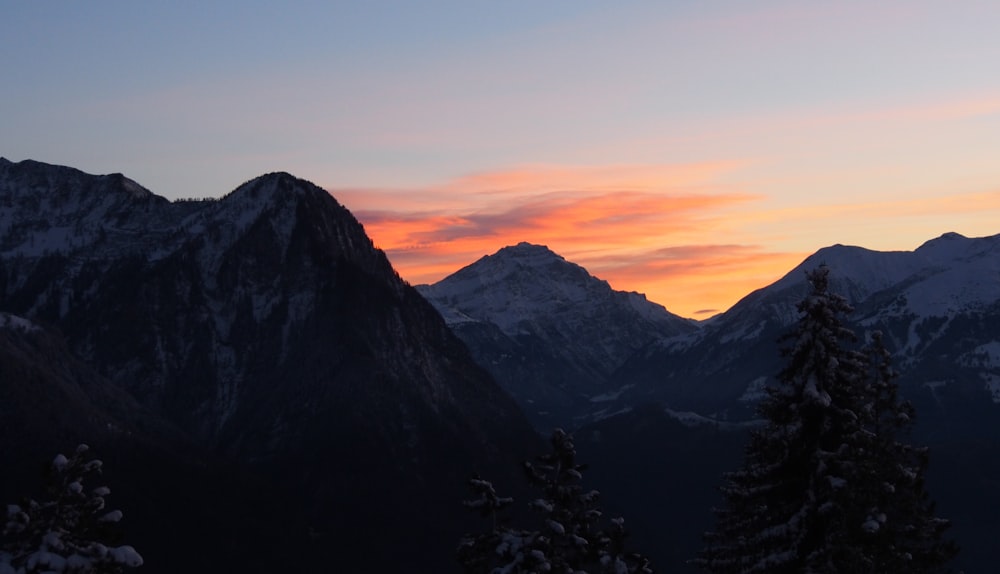 black and white mountains during sunset