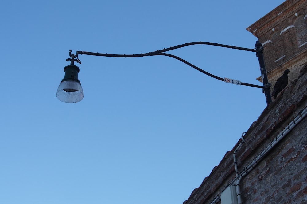 black light post under blue sky during daytime