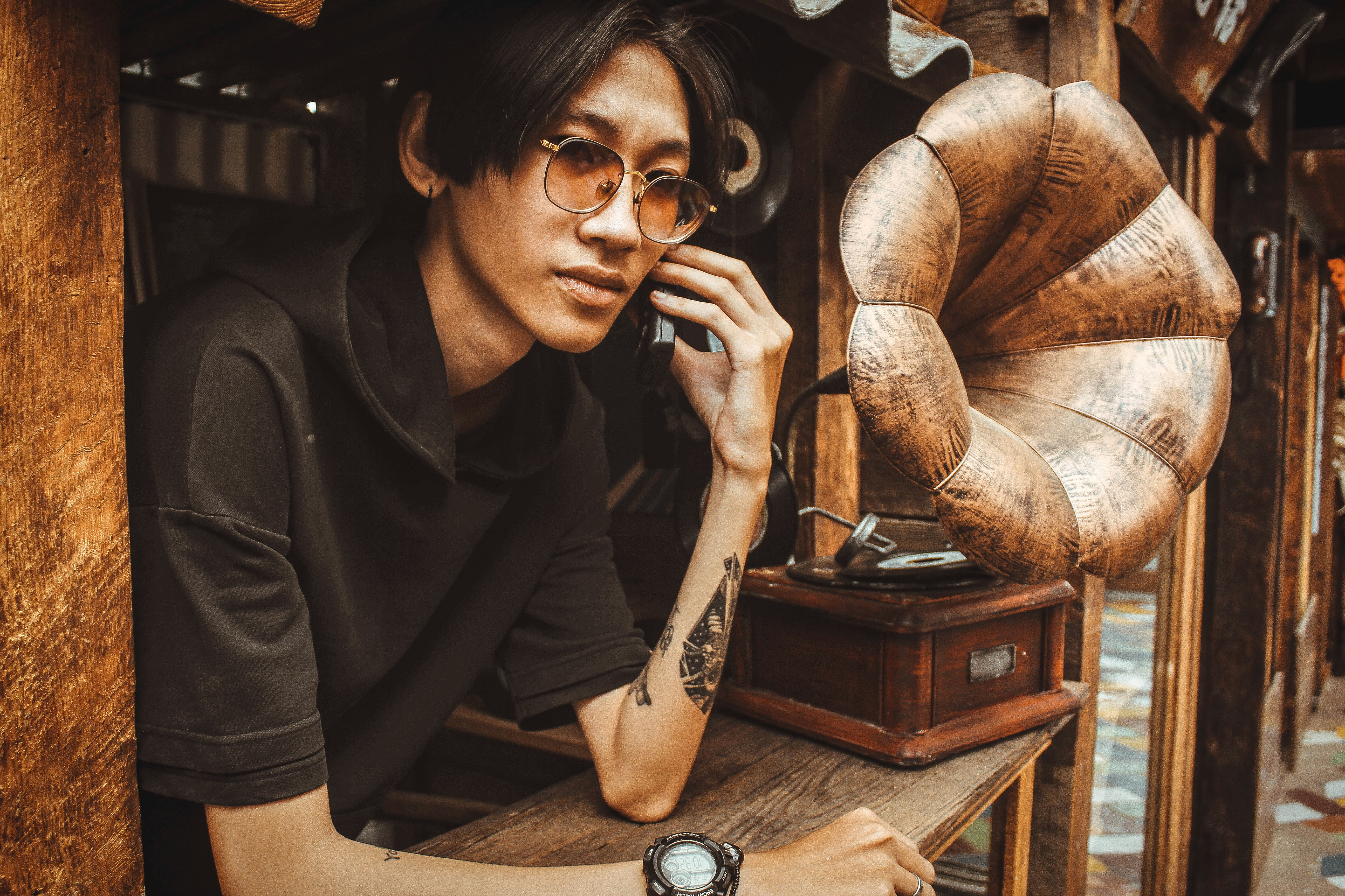 woman in black shirt wearing black framed eyeglasses